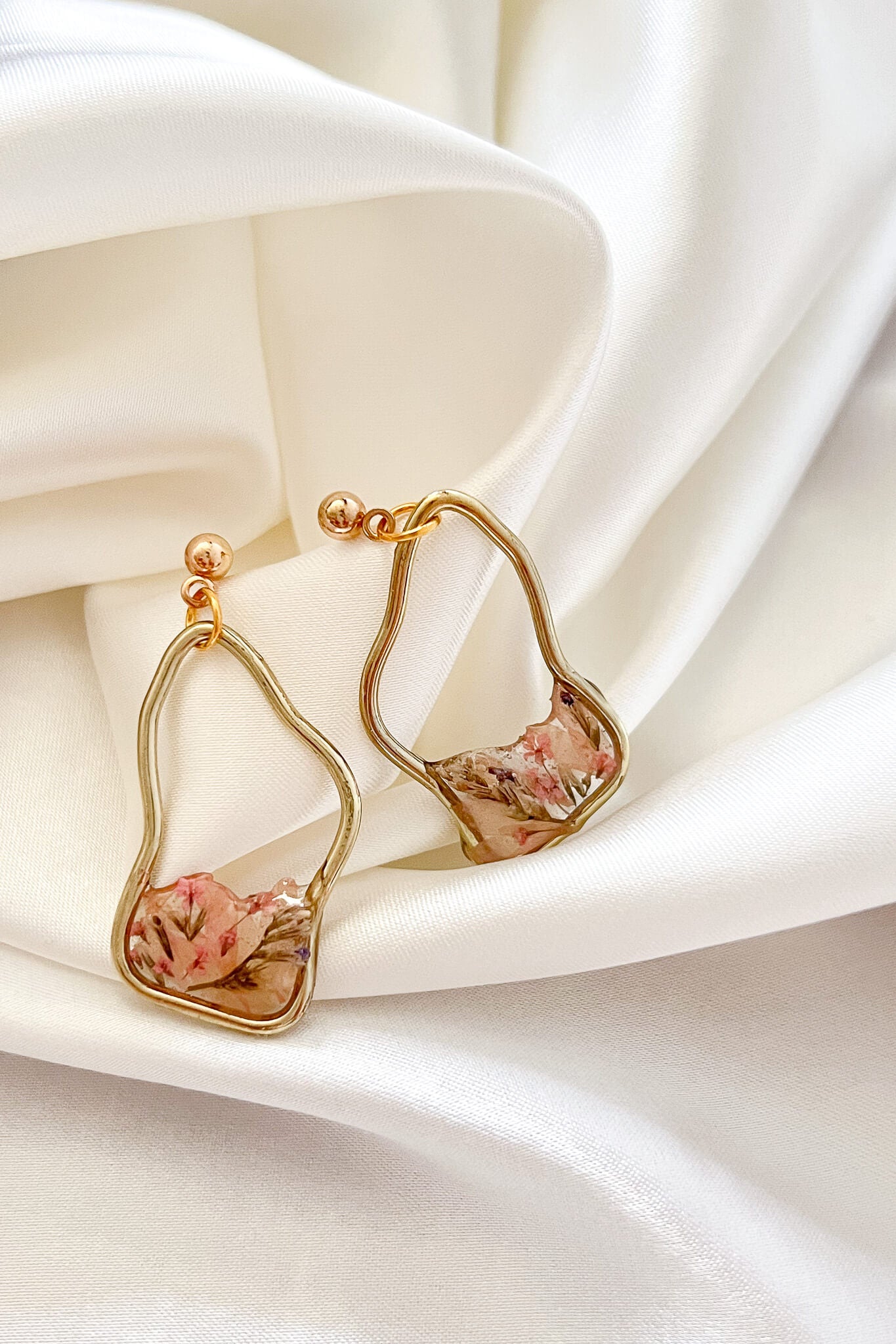Handmade resin dangle earrings with gold hardware and dried flowers