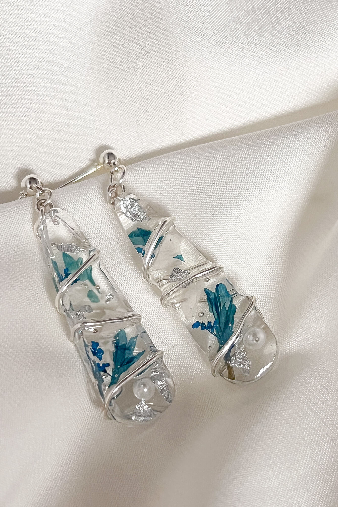 icy look silver dangle earrings - flowers and pearls in resin wrapped with silver jewelry wire