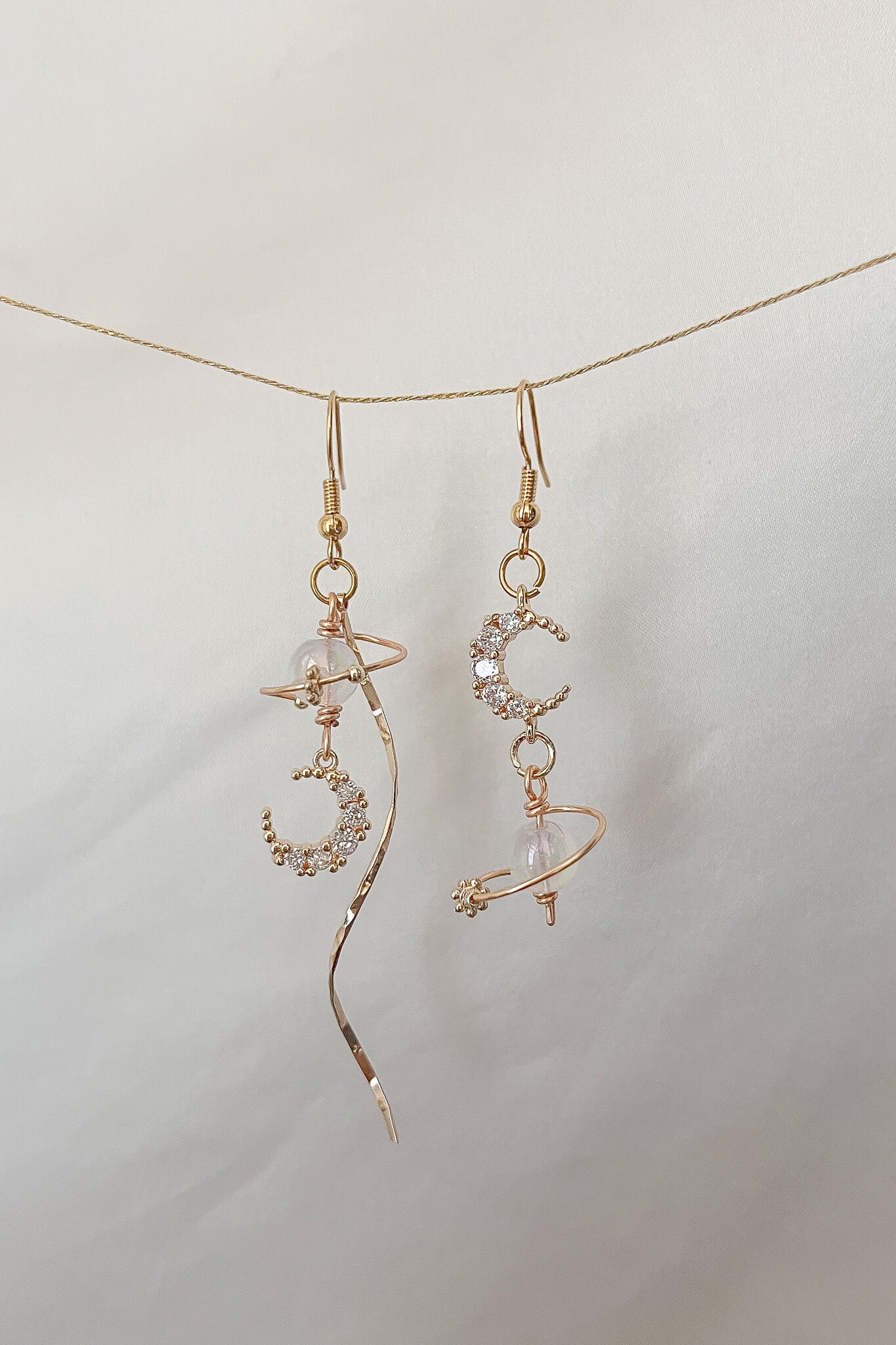 Inspired by taylor swift folklore seven dangling moon charm and saturn hook earrings in gold