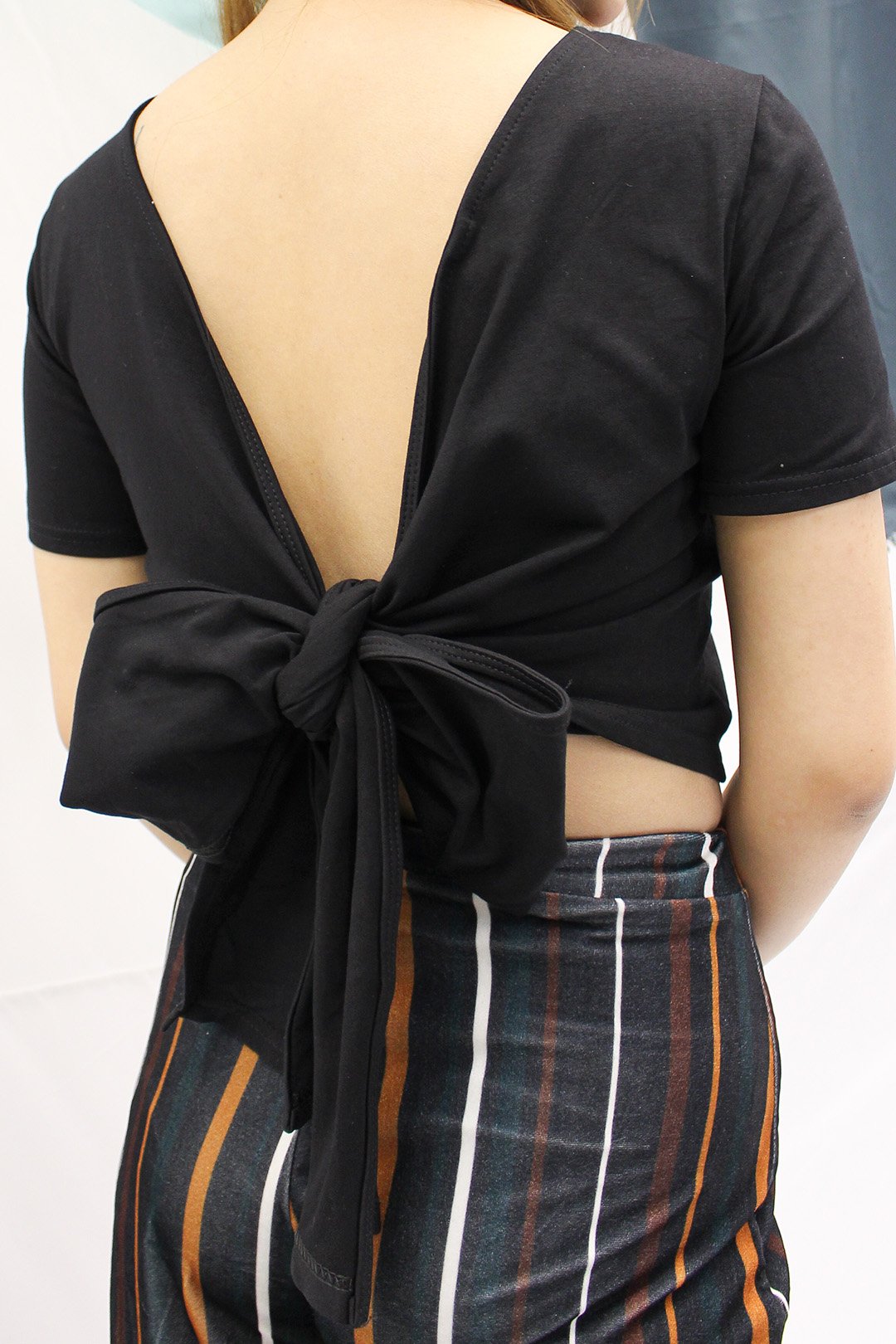 Soft cotton cropped tee with a twist - featuring a bow tie in the back