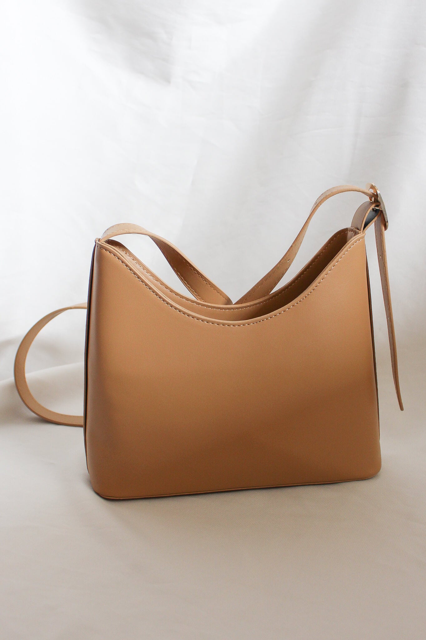 Small and simple shoulder carry bag with adjustable straps