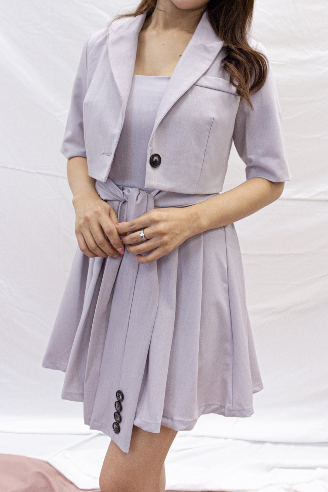 Pleated dress with cropped outwear, perfect for work