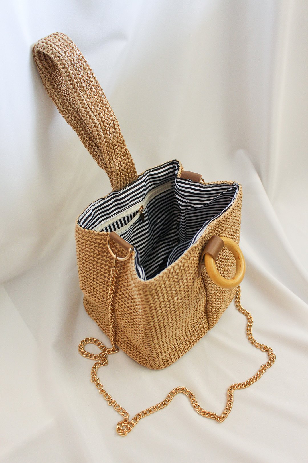 Trapezium rattan look straw Box Bag, perfect for summer with gold chain and wooden hoops. Summer beach vibe