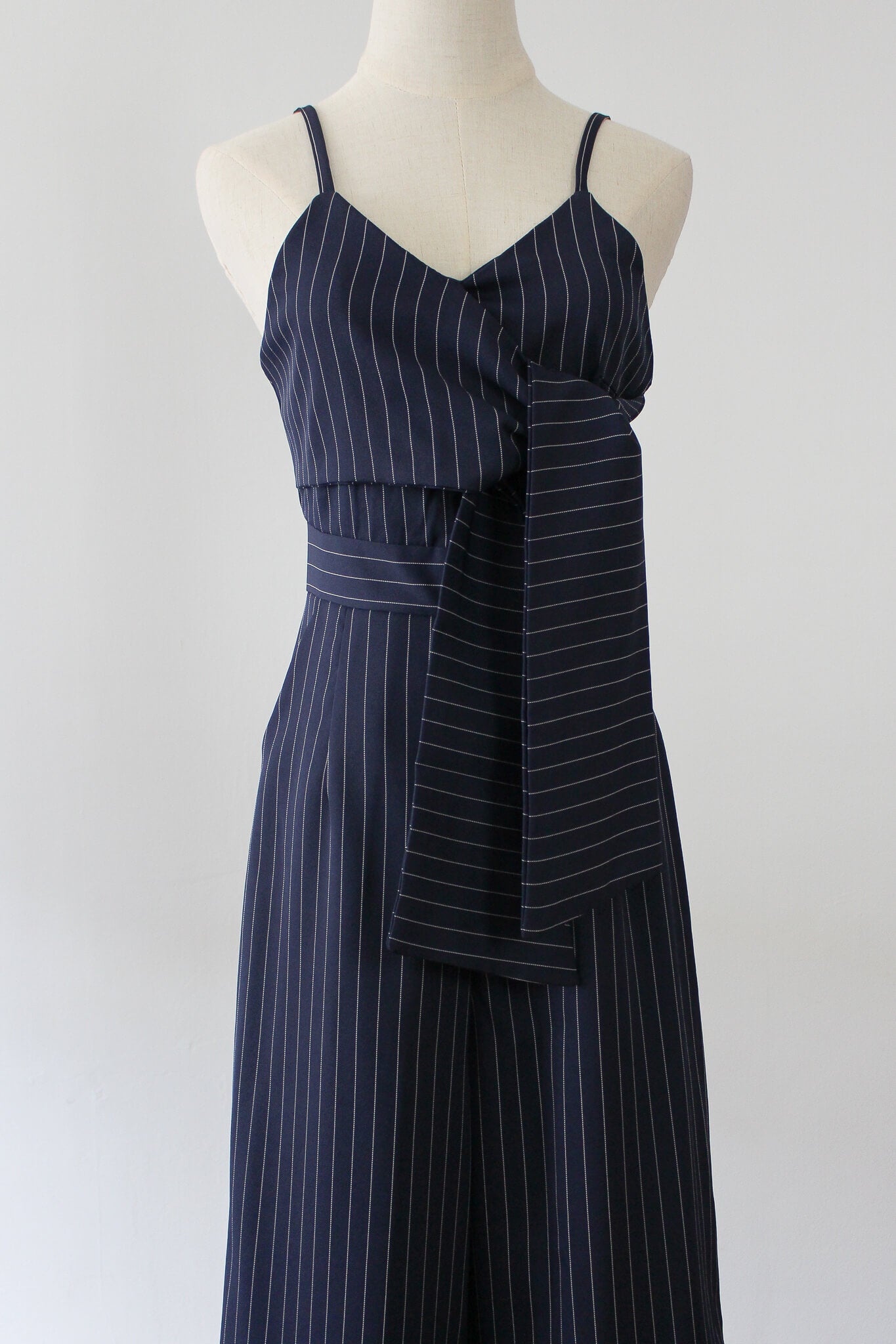 Striped jumpsuit with front twist. Perfect workwear or brunch outfit