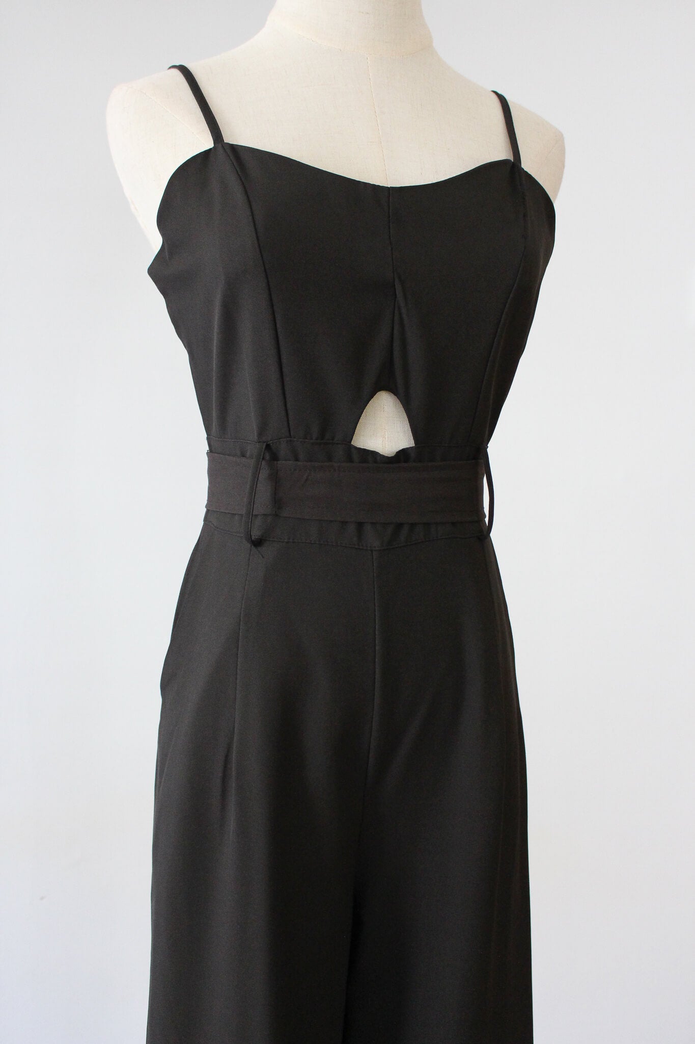 Belted Jumpsuit with small cut-out. Soft thin material perfect for summer. 