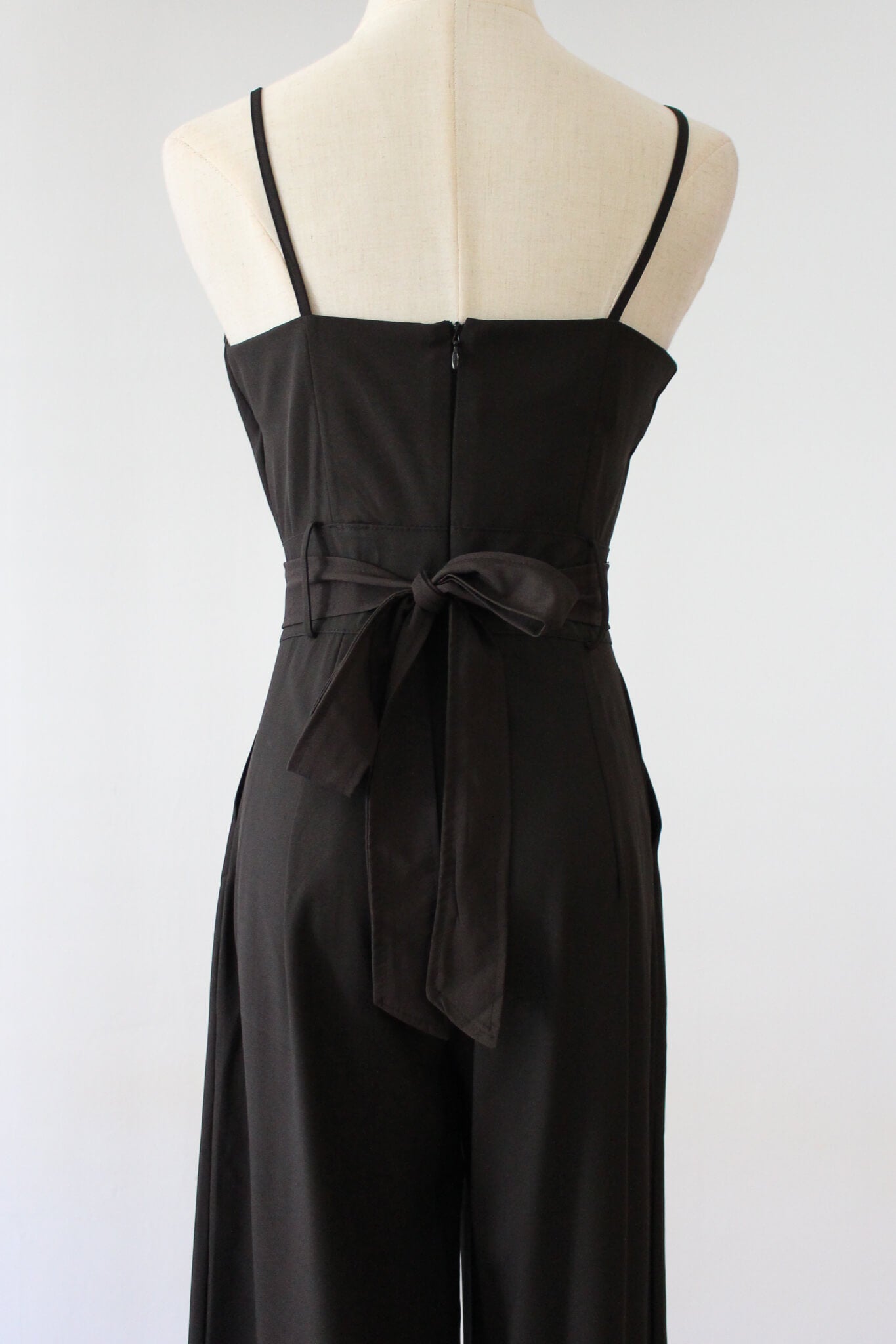 Belted Jumpsuit with small cut-out. Soft thin material perfect for summer. 