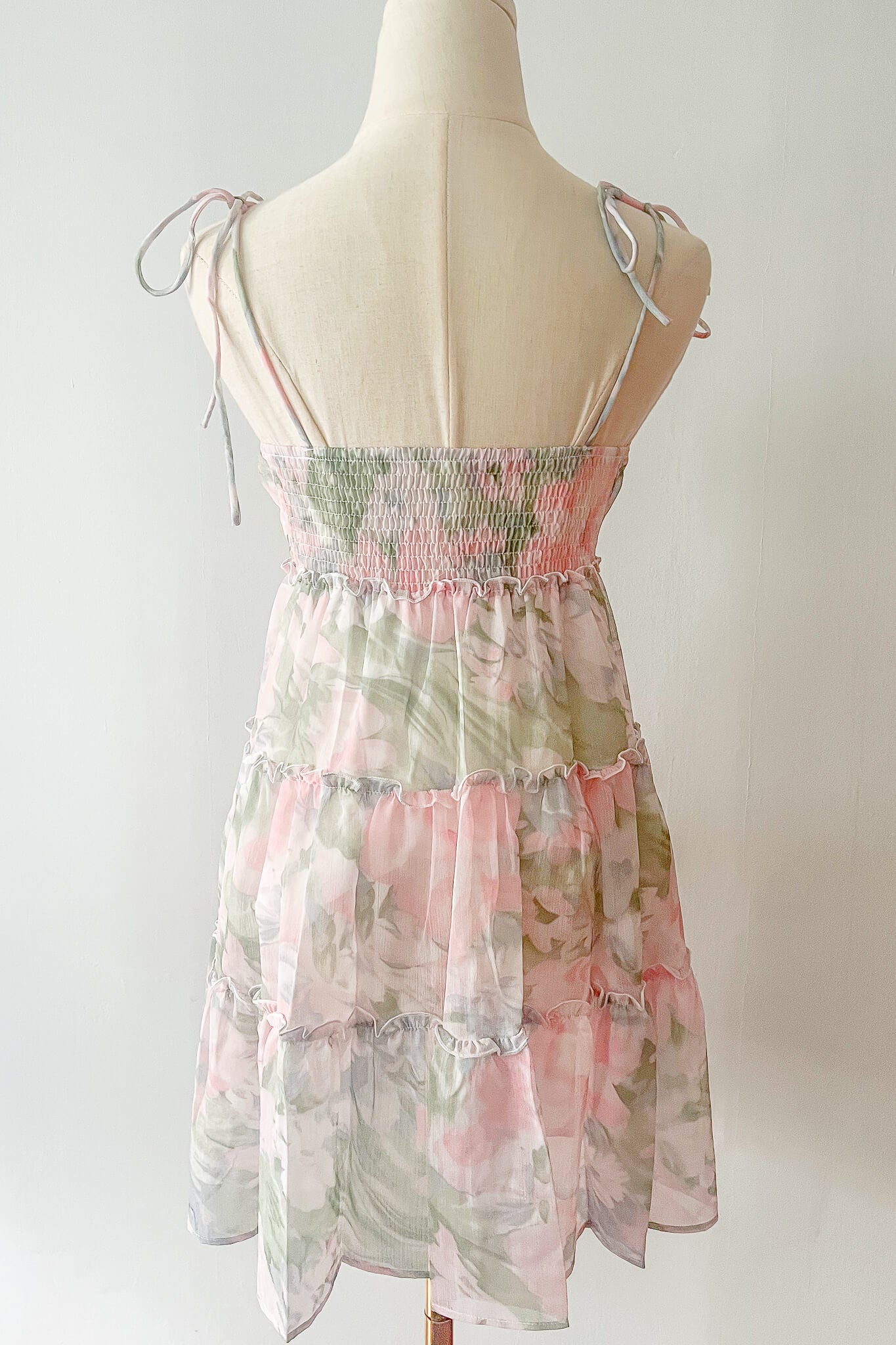 Sweet pink babydoll tier dress with self-tie adjustable straps, perfect for summer