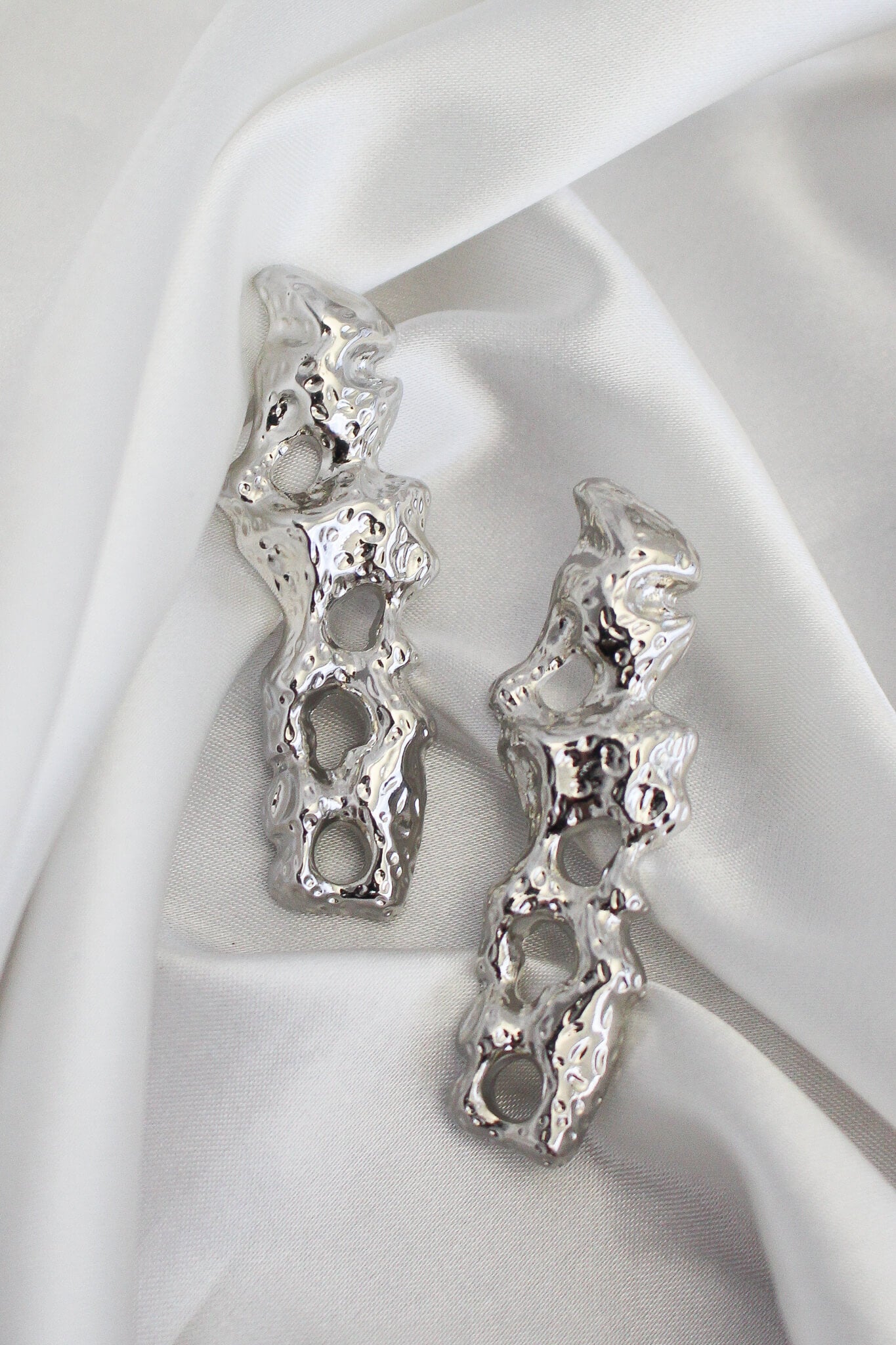 Silver odd shaped stud earrings